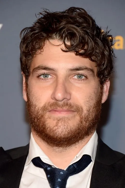 Adam Pally interpretando a Robert Weston