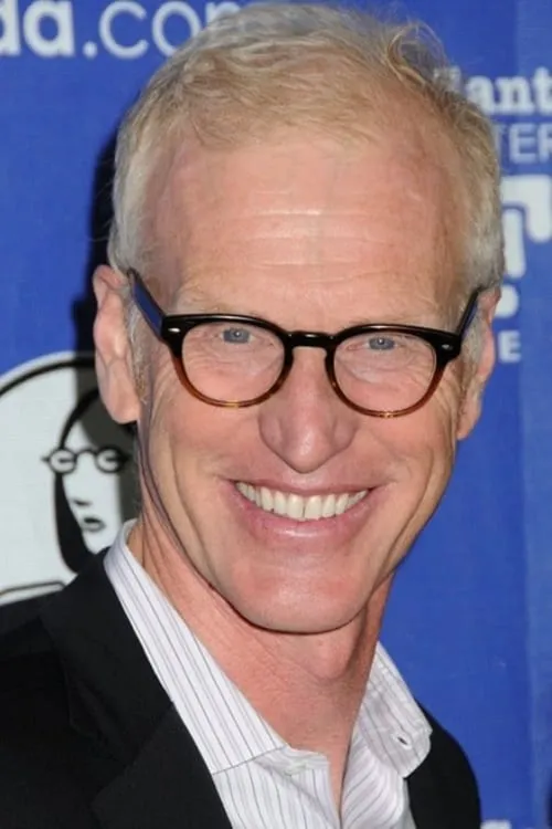 Brad Hall interpretando a Ned Runcie