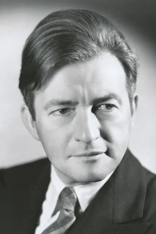 Claude Rains interpretando a Professor Benson