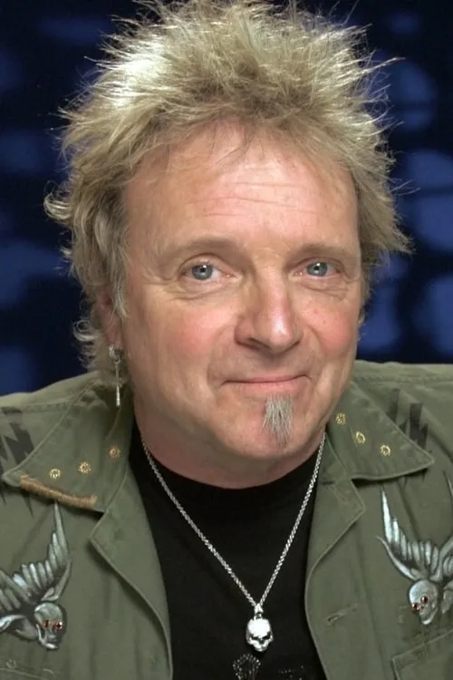 Joey Kramer interpretando a Drums, Percussion