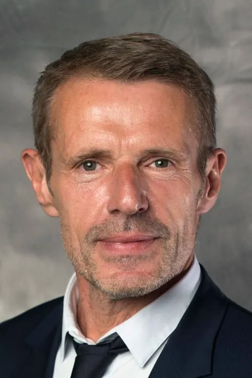 Lambert Wilson interpretando a Villain