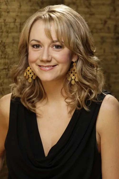 Megyn Price interpretando a Rhonda Dramond