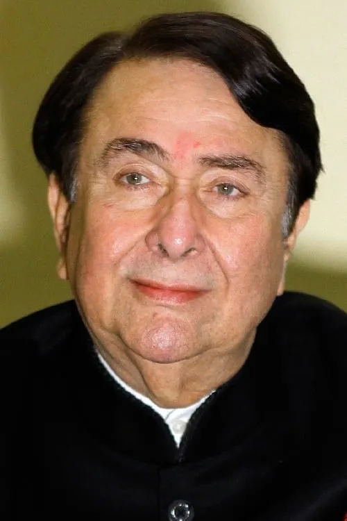 Randhir Kapoor interpretando a Kishore Samtani