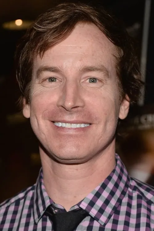 Rob Huebel interpretando a Drew