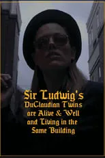 R Austin Ball interpreta a Sir Edward DuClaudian en Sir Ludwig's DuClaudian Twins are Alive & Well and Living in the Same Building